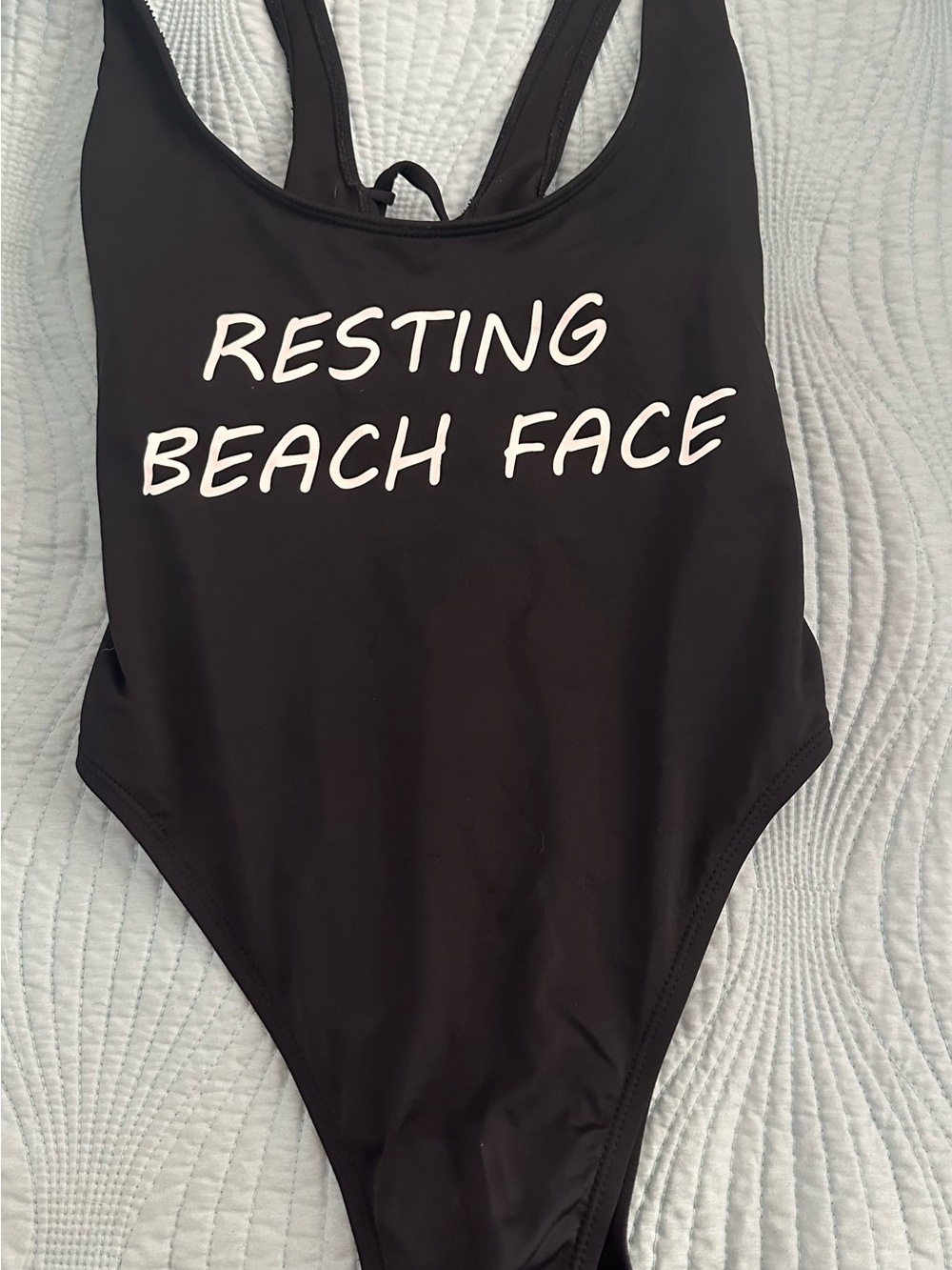 The Bikini Lab Black One-Piece Swimsuit with White 'Resting Beach Face' Print